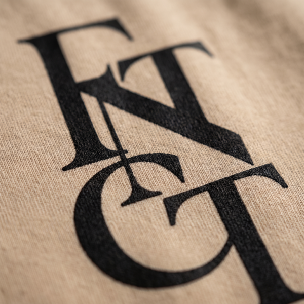 Macro detail of the FNTCT monogram printed on cotton