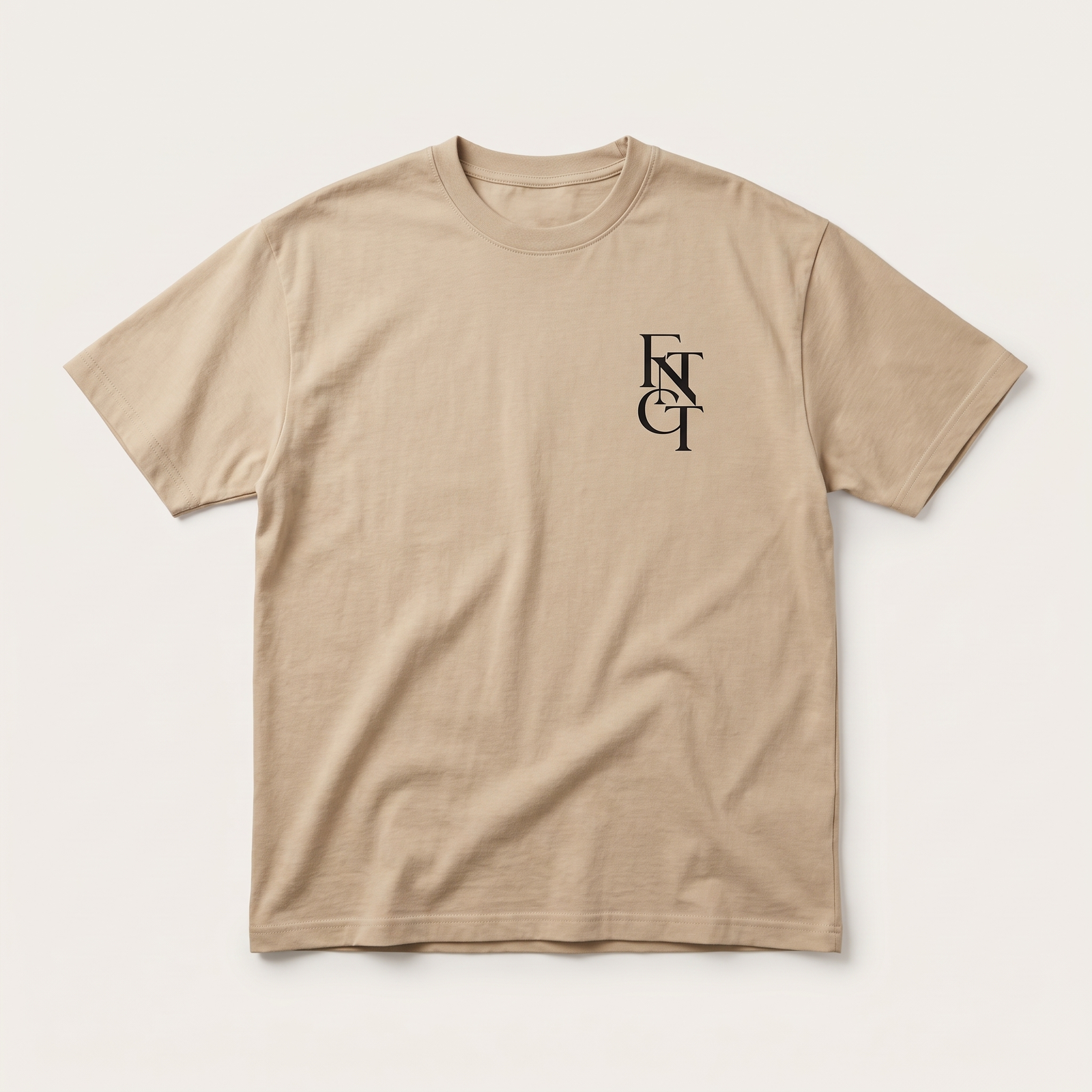 Soft cream FNTCT tee, front, monogram on left chest